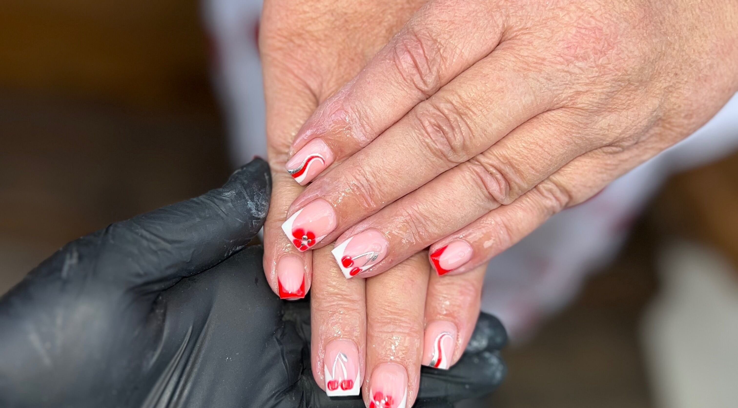 Red and white floral nail art at Nails by jodie-lea, Eccles, England, GB.