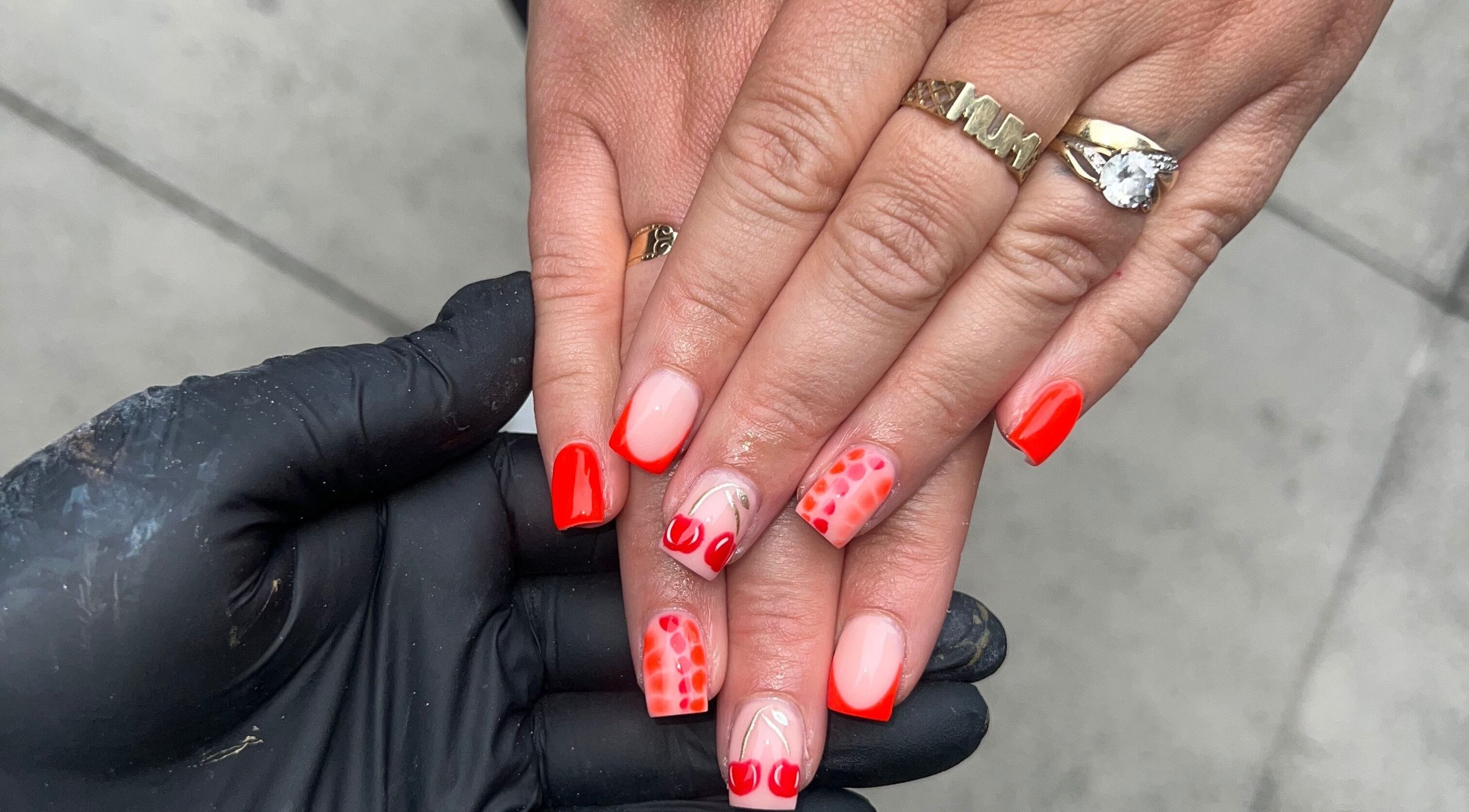 Stylish red and pink nail art at Nails by jodie-lea, Eccles, England, GB. Perfect blend of style and elegance.