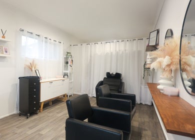 Chic interior of Brooke & Co Hair Salon in Ipswich, Queensland, AU with stylish chairs and decor.