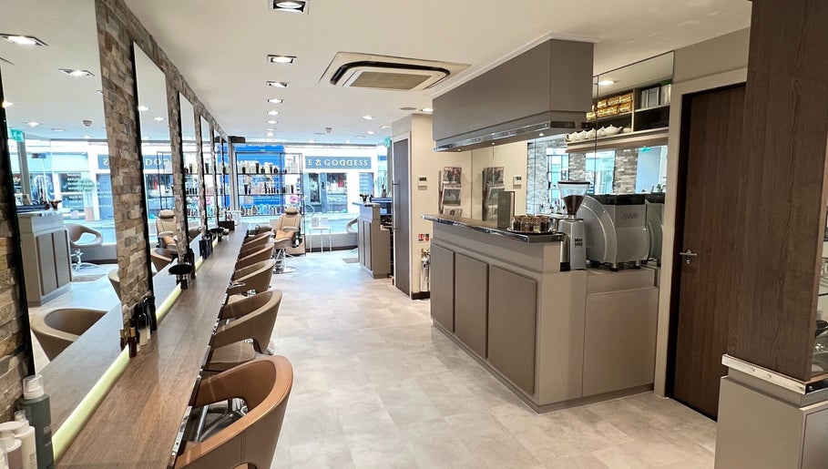 Interior of RYS Hair and Beauty, a chic salon in London, England, GB featuring stylish chairs and mirrors.