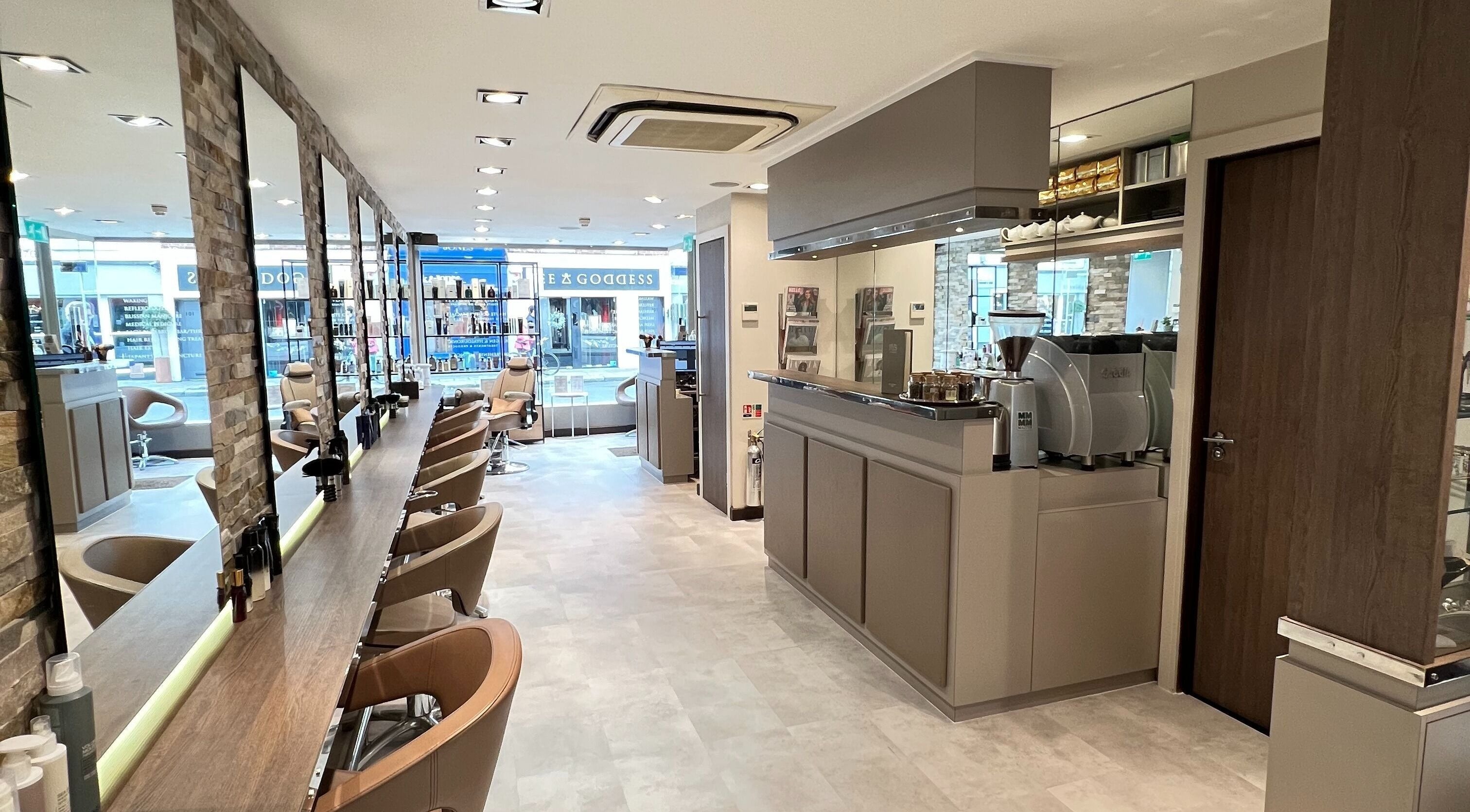 Interior of RYS Hair and Beauty, a chic salon in London, England, GB featuring stylish chairs and mirrors.