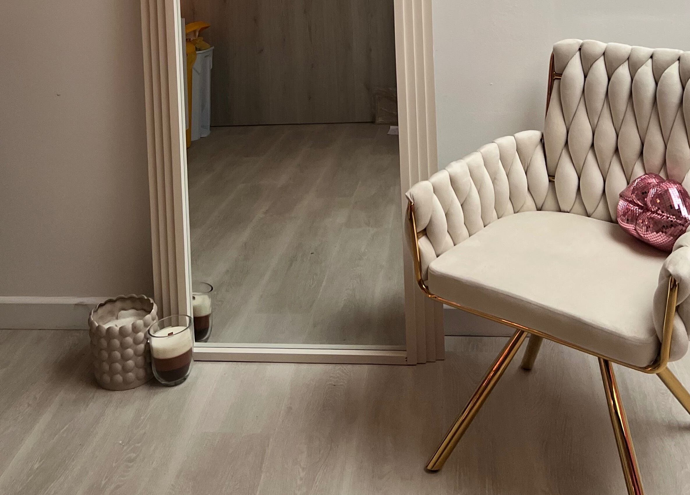 Cozy chair and mirror setup at Love Mi Aesthetics in Weymouth, England, GB for relaxing ambiance.