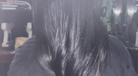 Smooth, shiny black hair styled at Hair Works by Allison in Princes Town, Princes Town Regional Corporation, TT.
