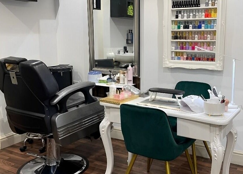 Elegant nail and hair station at MAJ STUDIO, Twickenham, England, GB featuring lush seating and vibrant polish display.