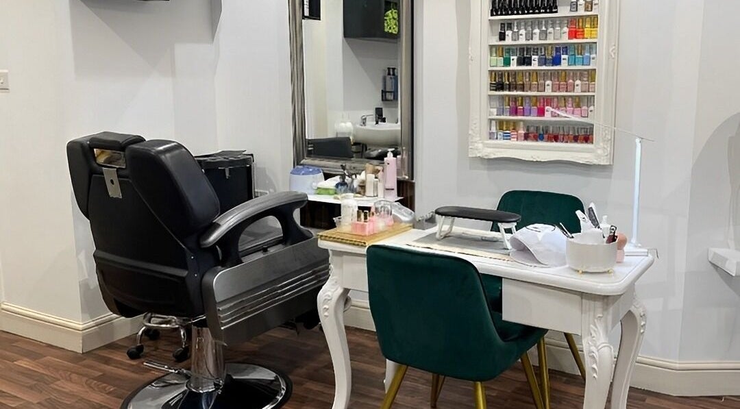 Elegant nail and hair station at MAJ STUDIO, Twickenham, England, GB featuring lush seating and vibrant polish display.