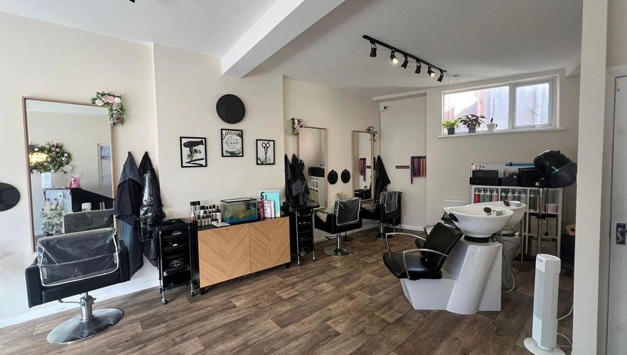 Modern salon interior at Fresh in Weston-super-mare, England, GB, featuring stylish salon chairs and wash stations.