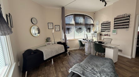 Calming beauty treatment room at Fresh, Weston-super-Mare, England, GB, with cozy massage bed and nail station.
