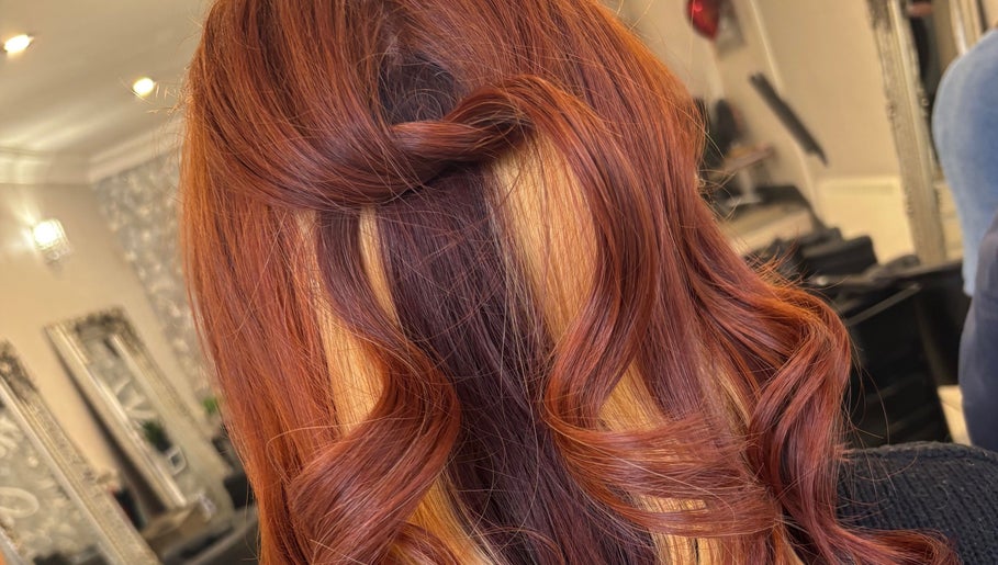 Stylish copper curls hairstyle at JH Hair in Stalybridge, England, GB.