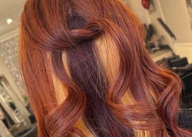 Stylish copper curls hairstyle at JH Hair in Stalybridge, England, GB.