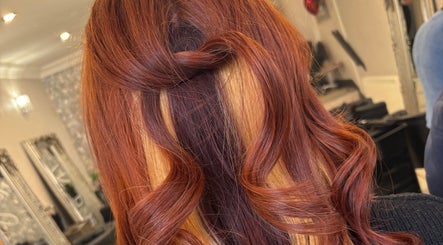 Stylish copper curls hairstyle at JH Hair in Stalybridge, England, GB.