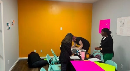 Team collaborating on bright plans at Lemon Sage Day Spa Salon, Scottsboro, Alabama, US.