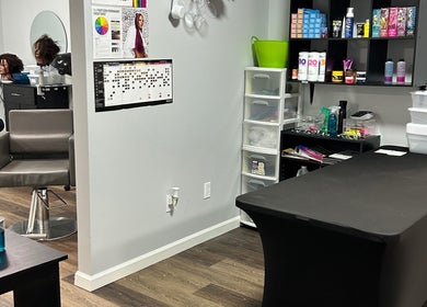 Modern salon space at Lemon Sage Day Spa Salon, Scottsboro, Alabama with styling chairs and beauty products.