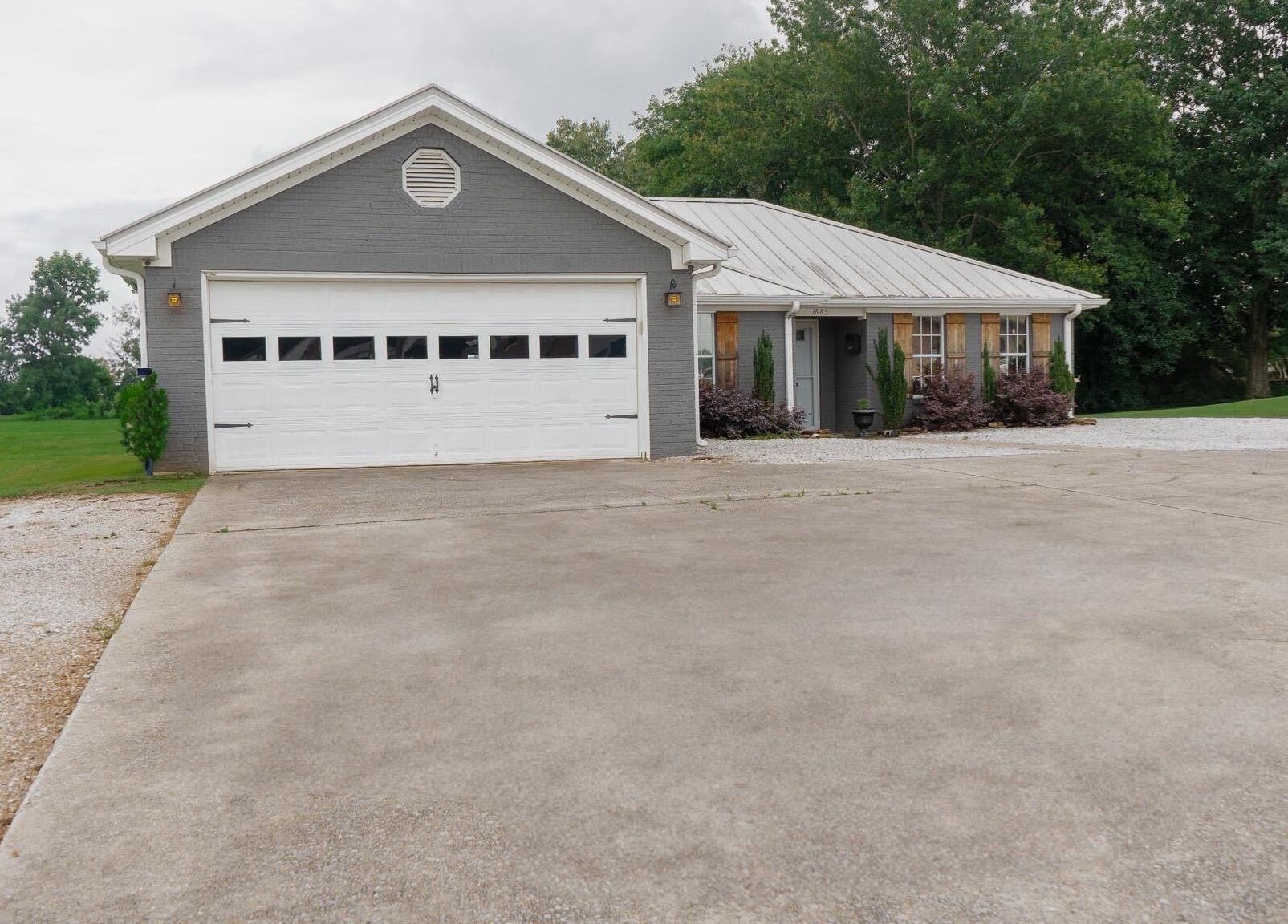Exterior of Ascend Beauty College Huntsville Campus in Huntsville, Alabama, US with driveway and greenery.