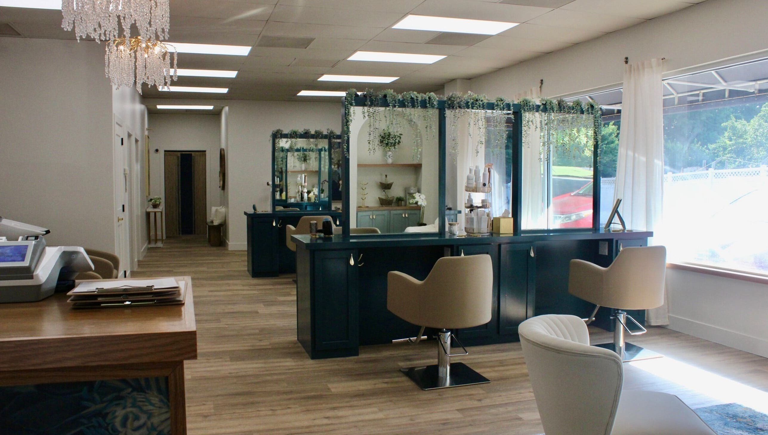 Luxurious interior of Restored Beauty Bar and Head Spa in Richmond, Virginia, US with chic decor and styling stations.