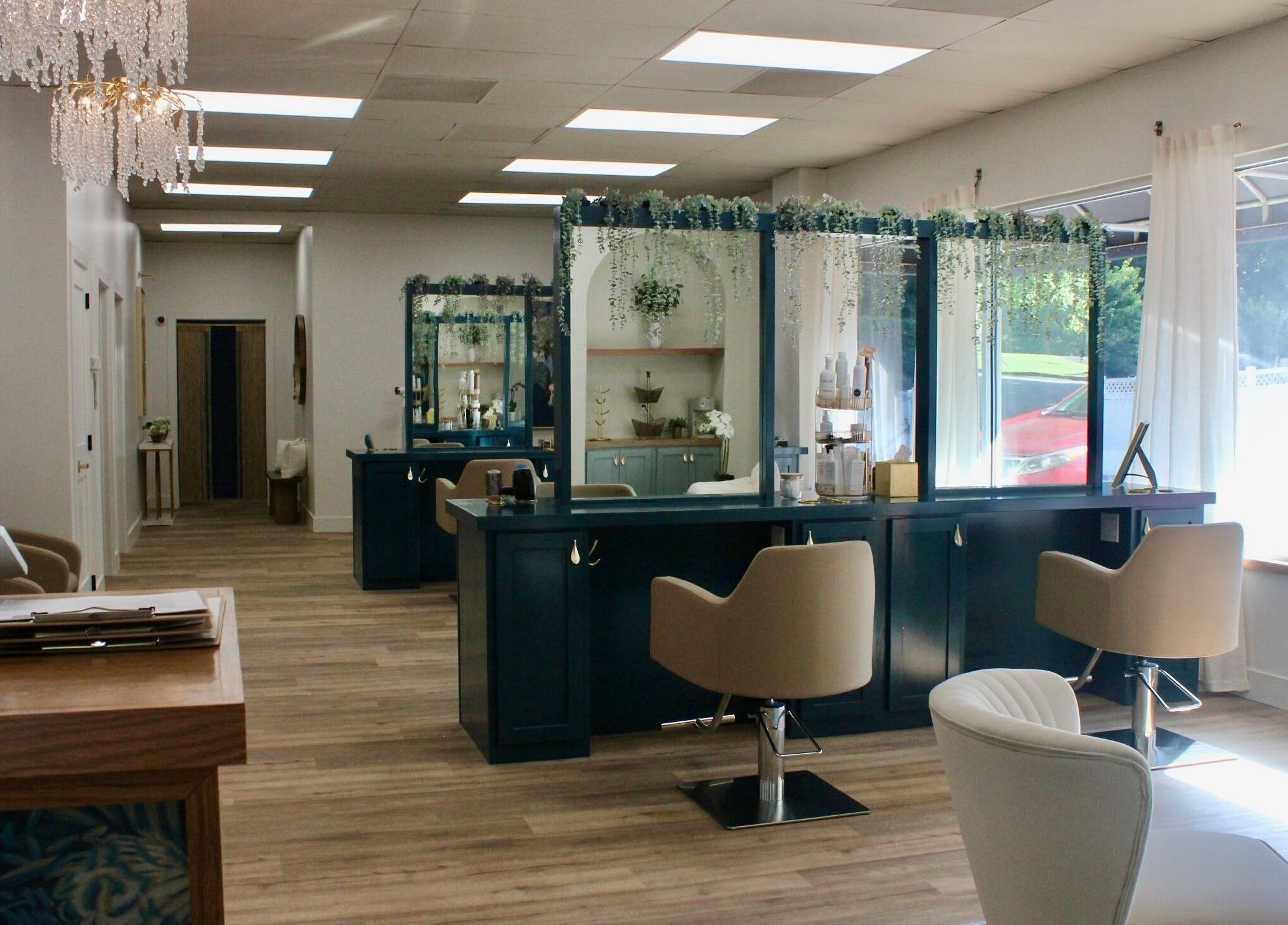 Luxurious interior of Restored Beauty Bar and Head Spa in Richmond, Virginia, US with chic decor and styling stations.