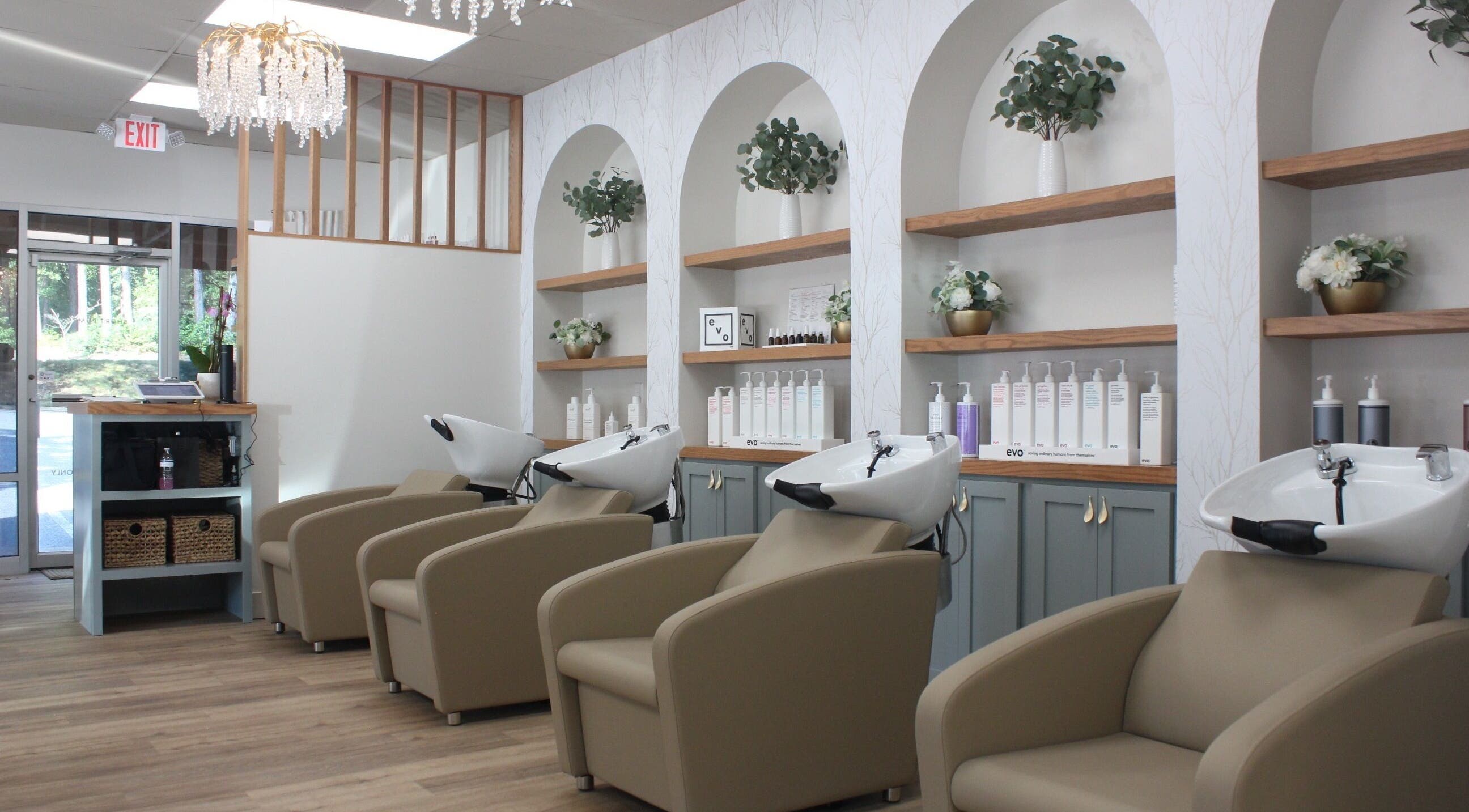Elegant interior of Restored Beauty Bar and Head Spa in Richmond, Virginia, US with plush chairs and modern decor.