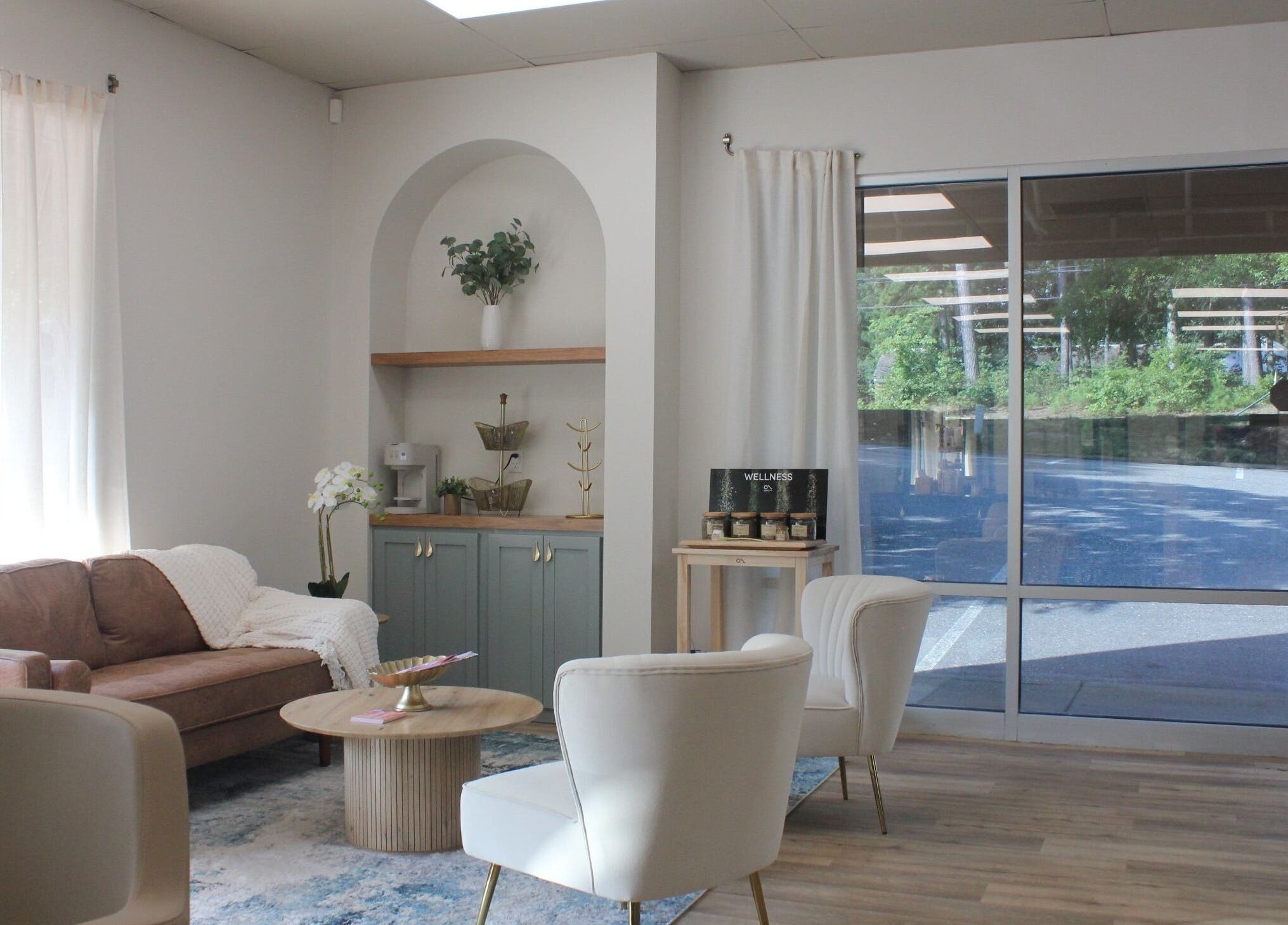 Inviting lounge area at Restored Beauty Bar and Head Spa in Richmond, Virginia, US. Cozy and stylish decor.