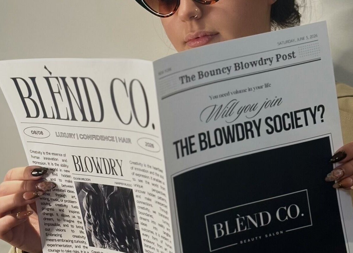 A person reading the Blènd Co. Blowdry Post in Stafford, England, GB, showcasing luxury beauty services.