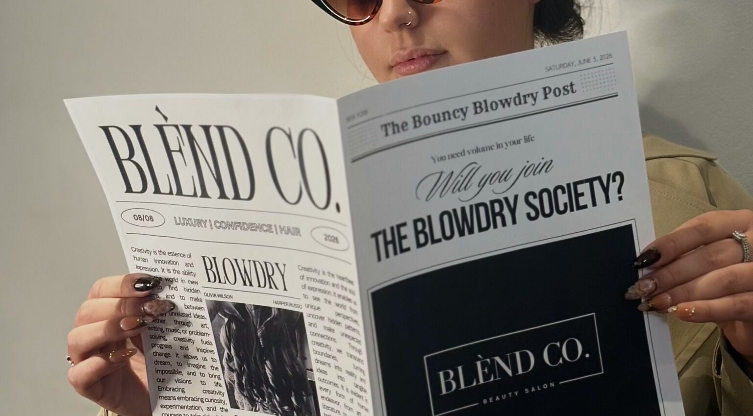 A person reading the Blènd Co. Blowdry Post in Stafford, England, GB, showcasing luxury beauty services.