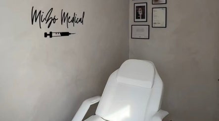 Treatment room at Mizo Medical Aesthetics, Hazel Grove, England, GB showcasing a comfortable white chair.