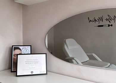Modern treatment room at Mizo Medical Aesthetics, Hazel Grove, England, GB featuring a sleek chair and elegant decor.