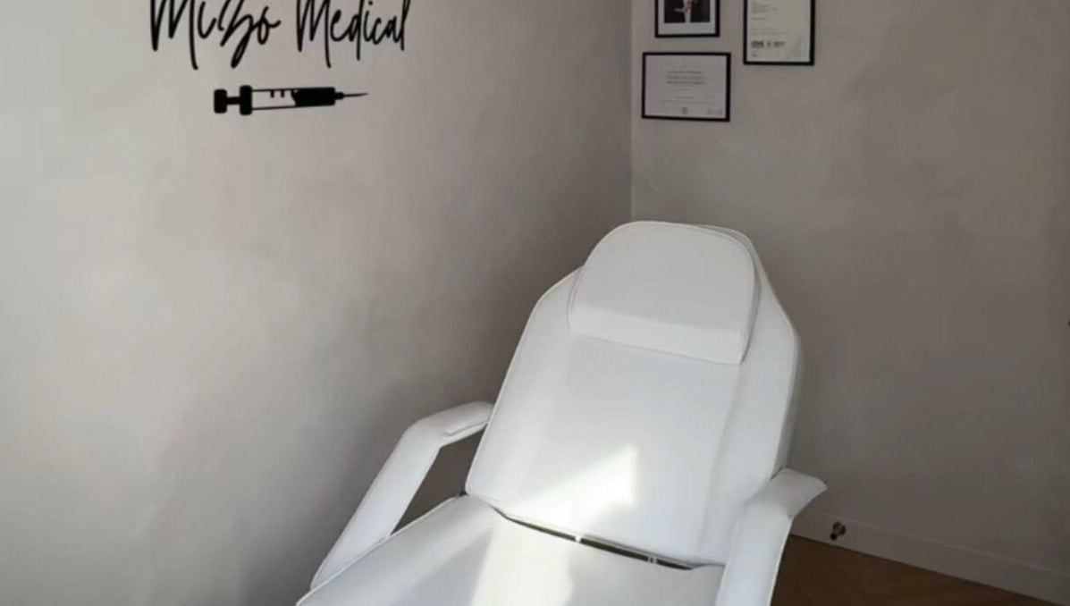Modern treatment chair at Mizo Medical Aesthetics, Hazel Grove, England, GB, showcasing a serene ambiance.