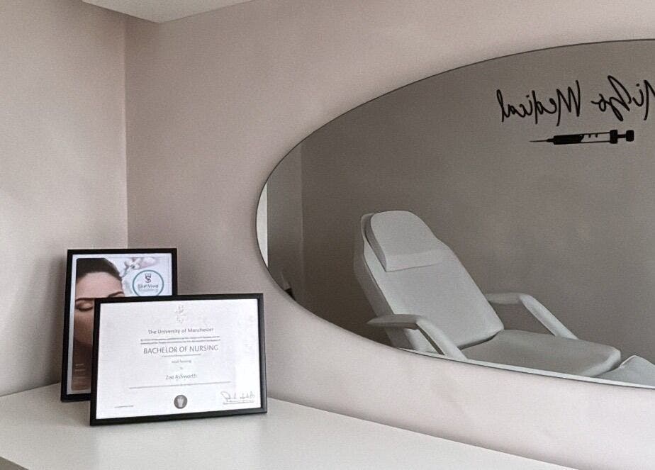 Calm treatment room at Mizo Medical Aesthetics, Hazel Grove, England, GB with diploma and sleek decor.