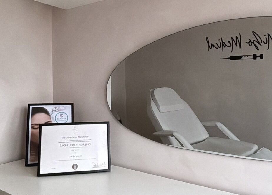 Calm treatment room at Mizo Medical Aesthetics, Hazel Grove, England, GB with diploma and sleek decor.