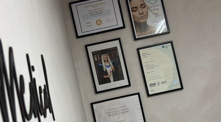 Framed certifications on display at Mizo Medical Aesthetics in Hazel Grove, England, GB.