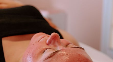 Relaxing facial treatment at Bloom Esthetics in Alabaster, Alabama, US, showcasing smooth skin care.