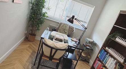 Cozy nail care station at Still Gloss by Abi in Basingstoke, England, GB with stylish decor and natural lighting.