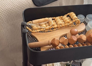Wooden massage tools at Skye Sculpting Lounge, Renfrew, Scotland, GB, showcasing relaxation aids.