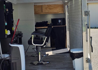 Interior of Mefalani Mobile Barbershop in Thorndale, Ontario, CA showcasing a sleek chair and modern equipment.