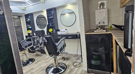 Modern interior of Mefalani Mobile Barbershop in Thorndale, Ontario, CA with stylish chairs and mirrors.
