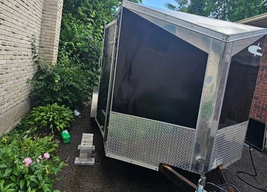 Mefalani Mobile Barbershop trailer parked at Thorndale, Ontario, CA, offering convenient grooming services.