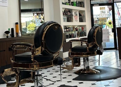 Stylish vintage chairs at Top Fade Barbers in Melbourne, Victoria, AU, highlighting luxury barber experience.