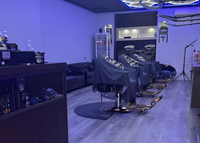 Modern interior of Top Fade Barbers in Melbourne, Victoria, AU, featuring stylish barber chairs and vibrant decor.