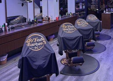 Modern interior of Top Fade Barbers in Melbourne, Victoria, AU featuring stylish barber chairs.
