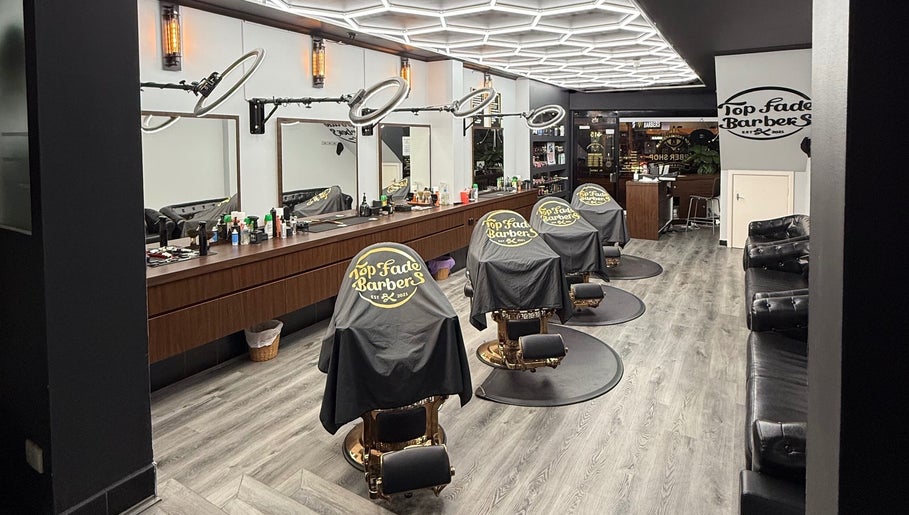 Interior of Top Fade Barbers, Melbourne, Victoria, AU, showcasing modern barber chairs and sleek decor.