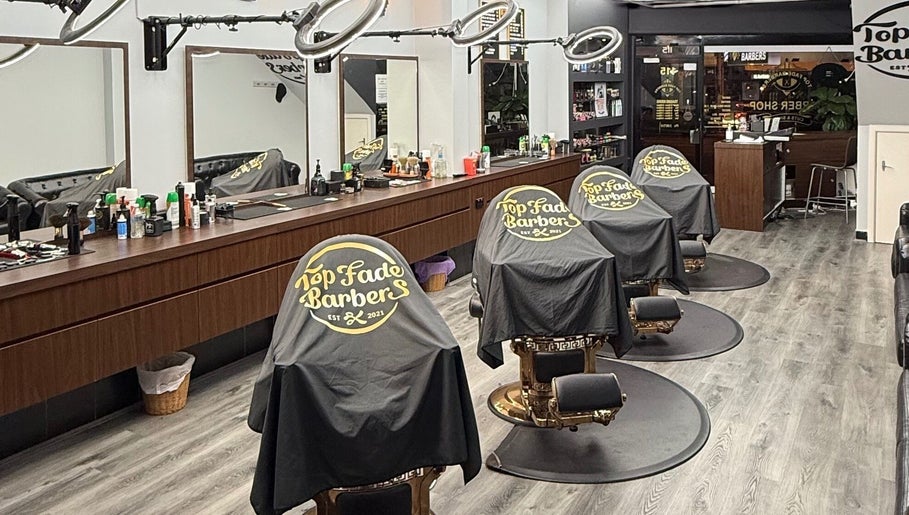 Stylish interior of Top Fade Barbers in Melbourne, Victoria, AU showcasing modern barber chairs and sleek design.