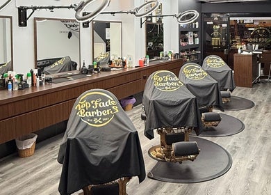 Stylish interior of Top Fade Barbers in Melbourne, Victoria, AU showcasing modern barber chairs and sleek design.