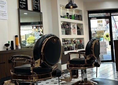 Stylish interior of Top Fade Barbers in Melbourne, Victoria, AU showcasing luxury barber chairs and products.