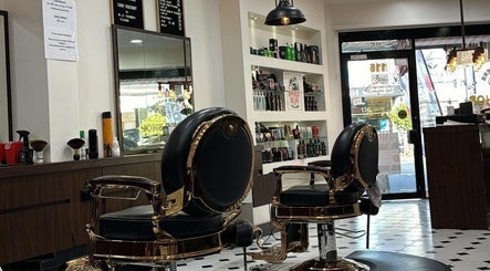 Stylish interior of Top Fade Barbers in Melbourne, Victoria, AU showcasing luxury barber chairs and products.