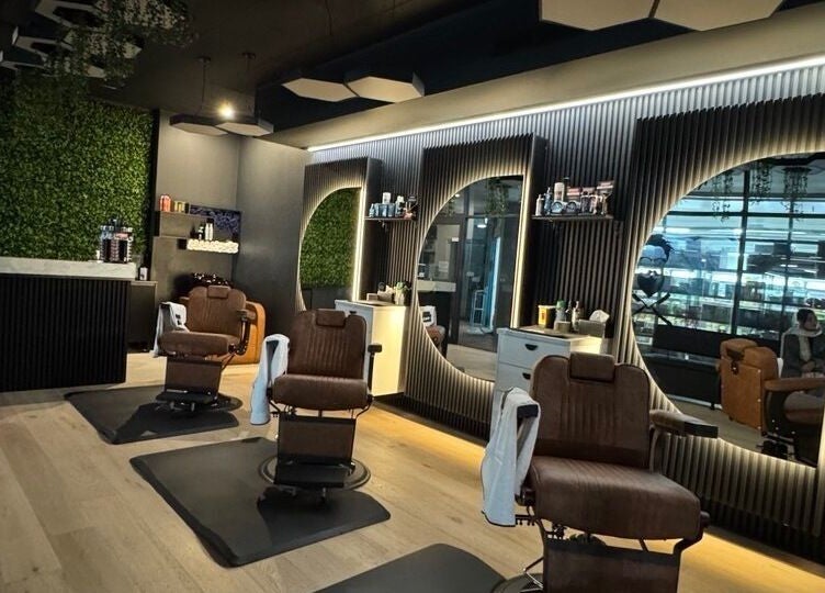 Interior of Top Fade Barbers Ivanhoe with chic decor, Melbourne, Victoria, AU. Stylish barber chairs and mirrors.