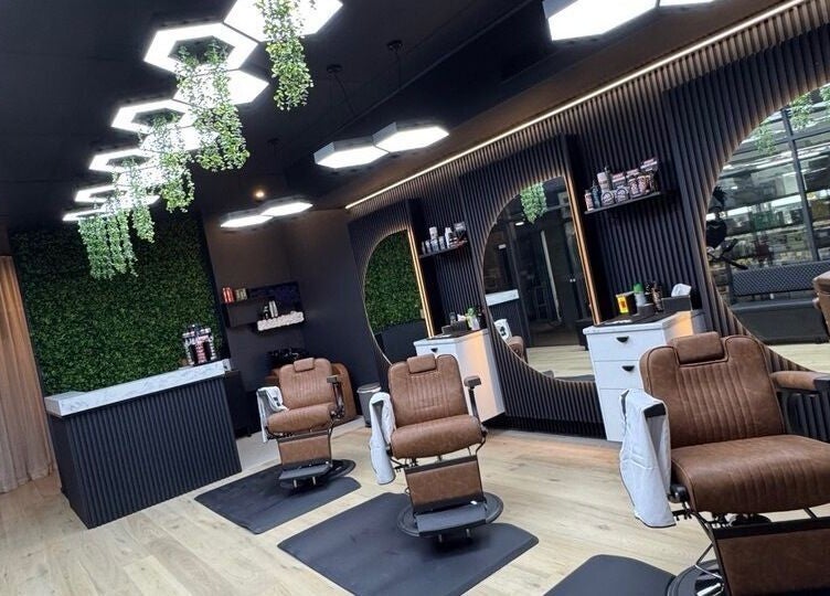 Interior of Top Fade Barbers Ivanhoe, Melbourne, Victoria, AU, featuring stylish chairs and modern decor.