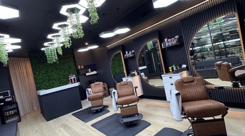 Interior of Top Fade Barbers Ivanhoe, Melbourne, Victoria, AU, featuring stylish chairs and modern decor.