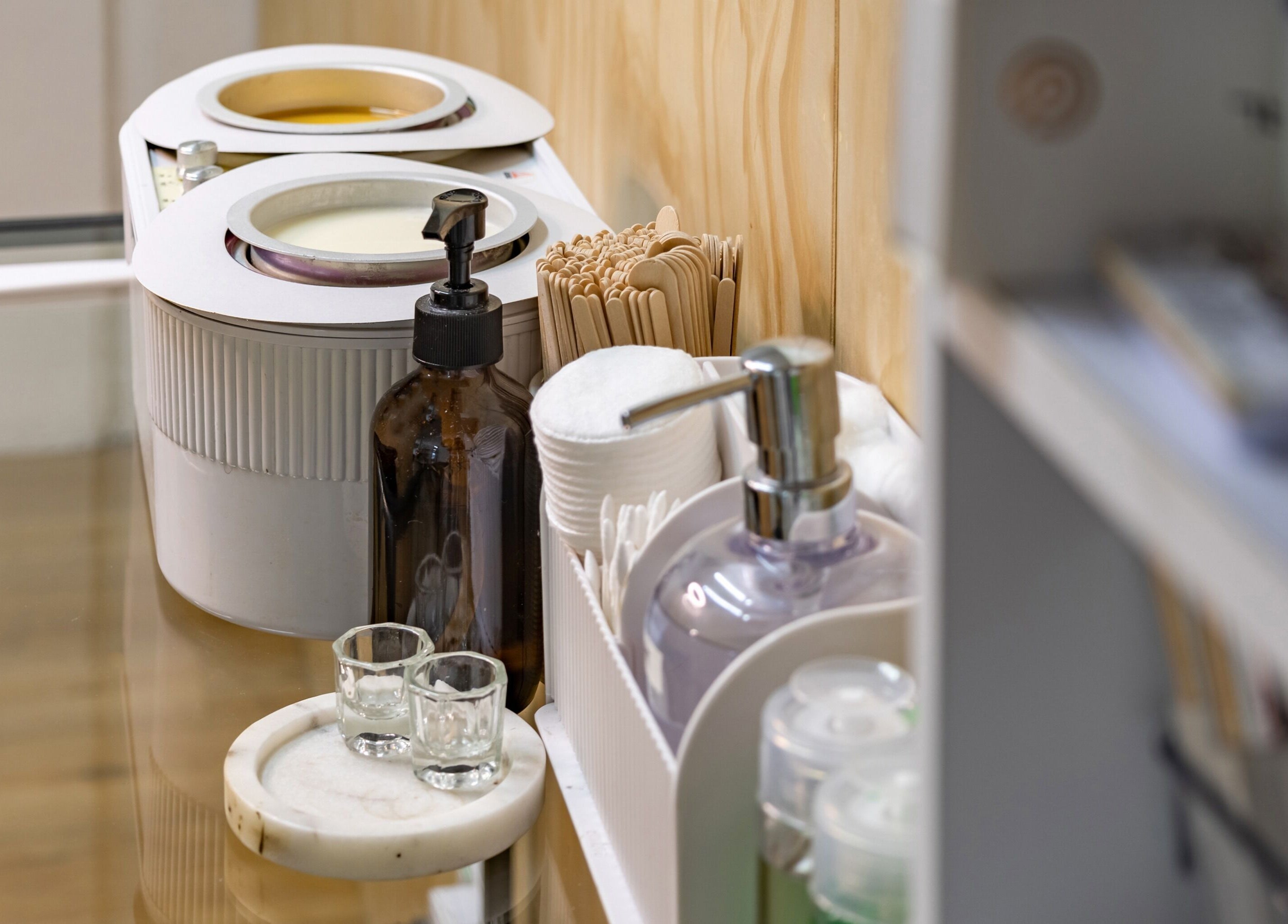 Calm beauty station at Brows Defined, Christchurch, Waitaha, NZ with waxing tools and skincare products.