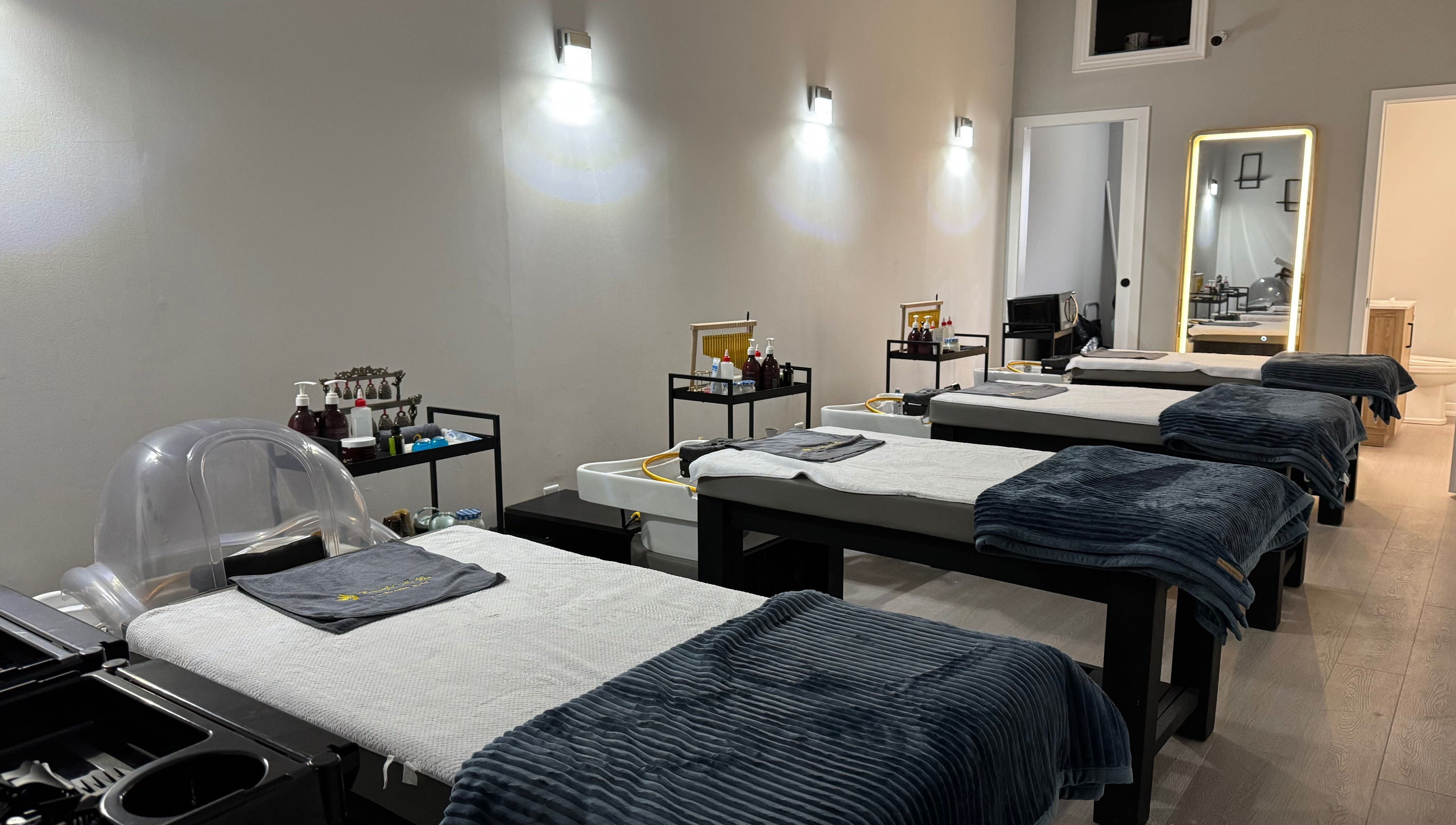 Calm treatment room at Beautiful Me Spa & Wellness Clinic, Toronto, Ontario, CA, showcasing massage tables.