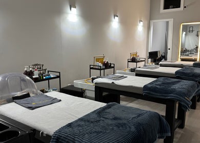 Calm treatment room at Beautiful Me Spa & Wellness Clinic, Toronto, Ontario, CA, showcasing massage tables.