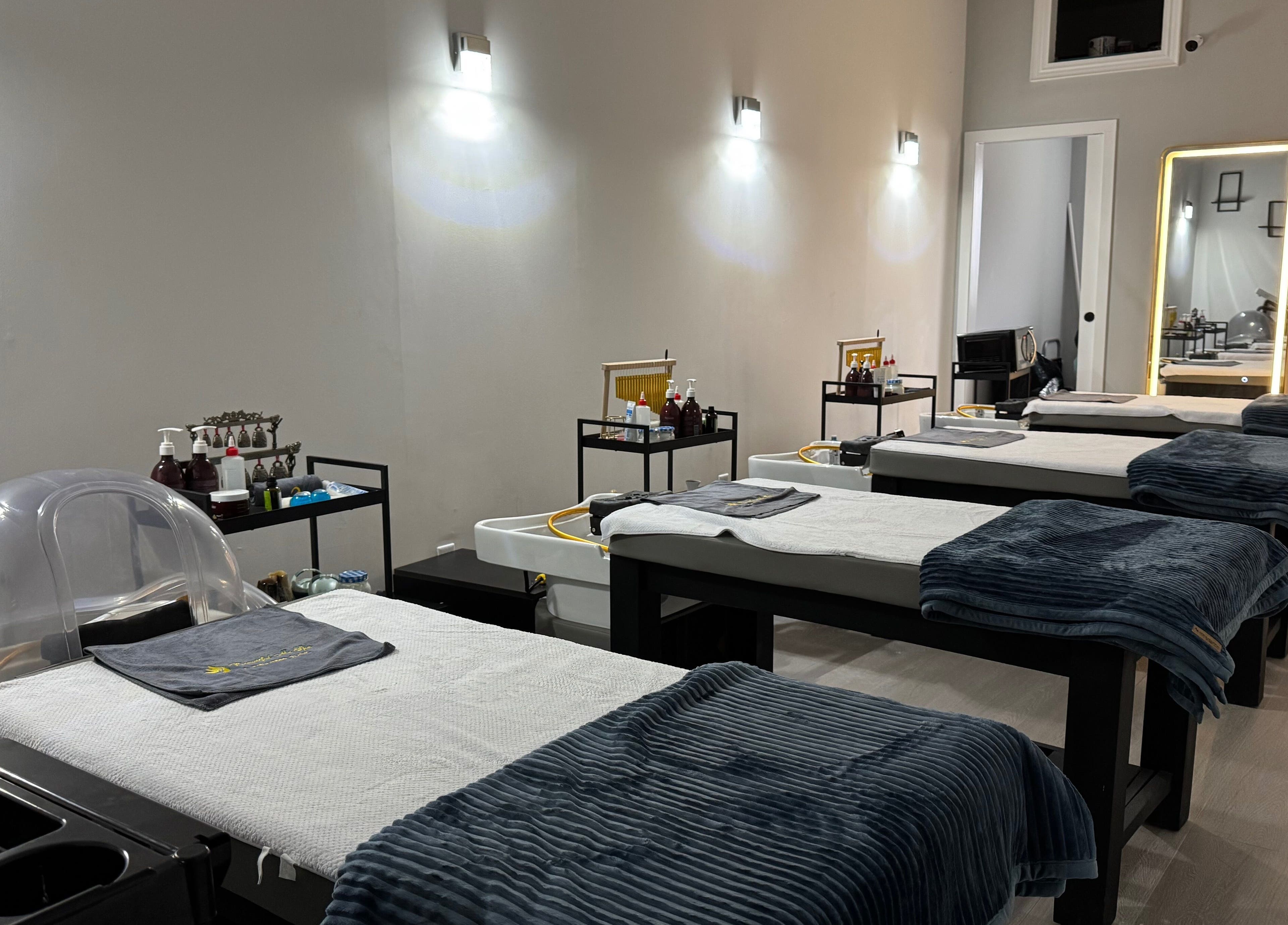 Calm treatment room at Beautiful Me Spa & Wellness Clinic, Toronto, Ontario, CA, showcasing massage tables.